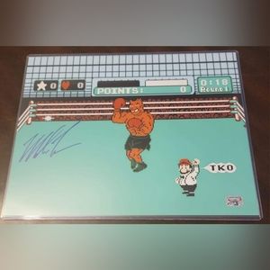 Mike Tyson signed Punch Out 11x14 photo.